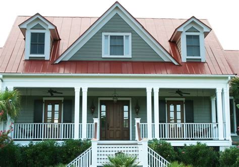 picture house with red metal roof and dark grey siding|grey exterior house with red roof.